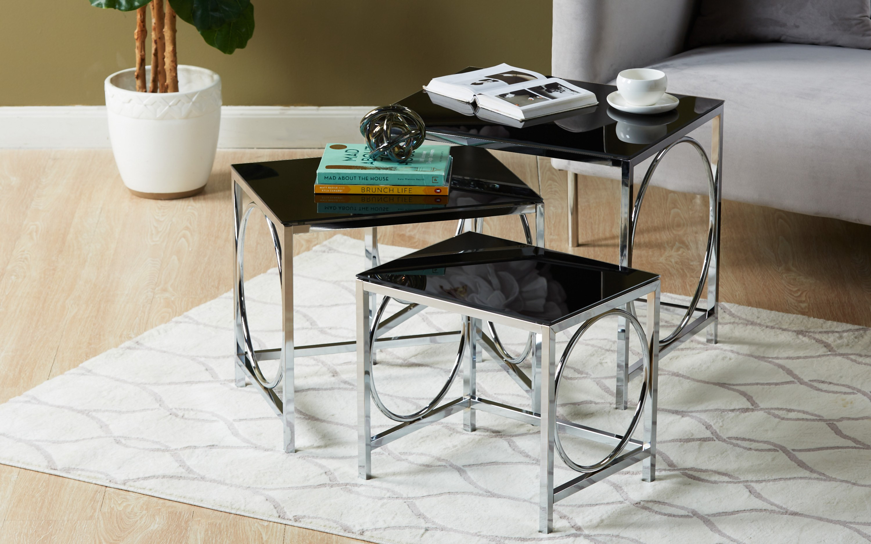 Glass chrome nest store of tables