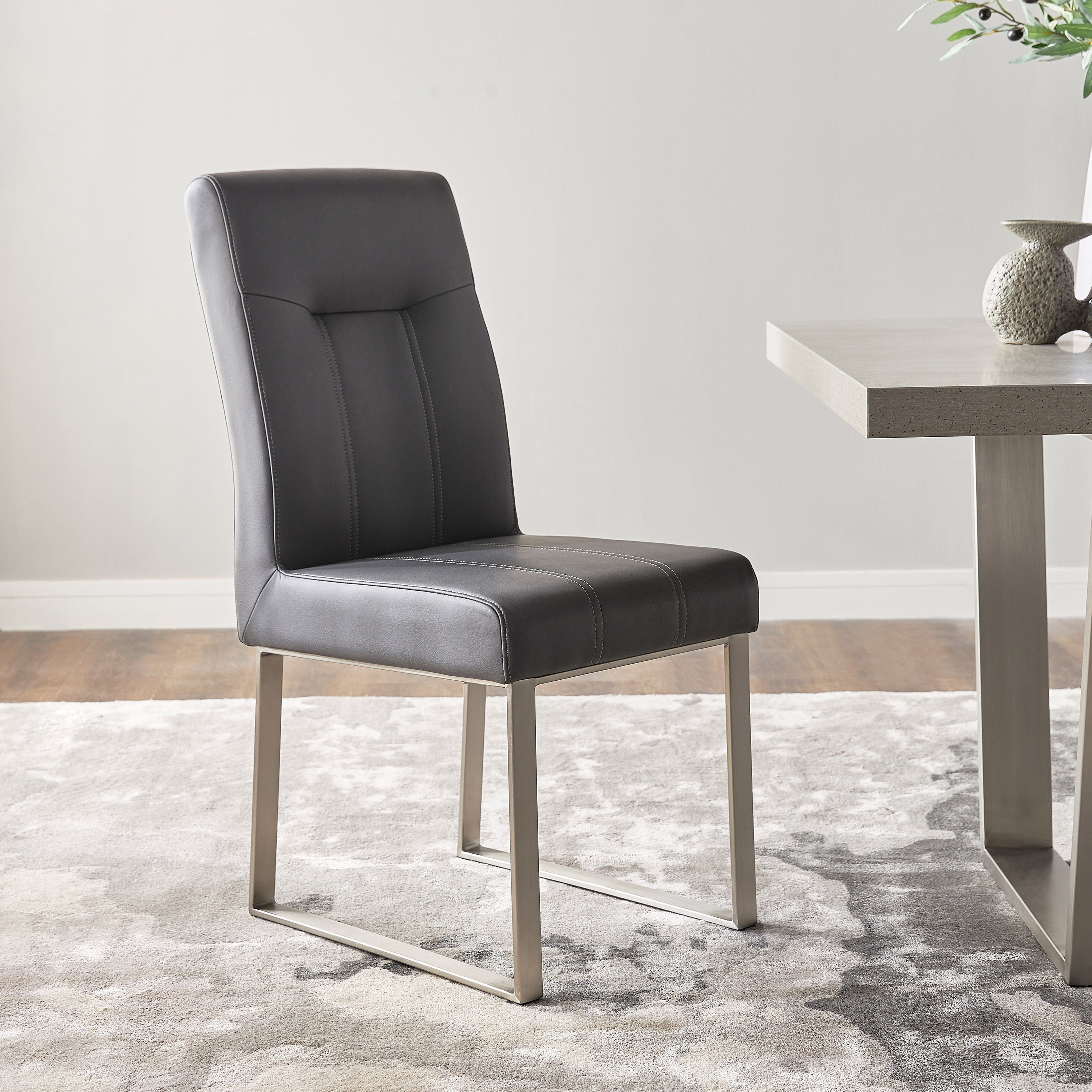 Gray faux leather store dining chairs