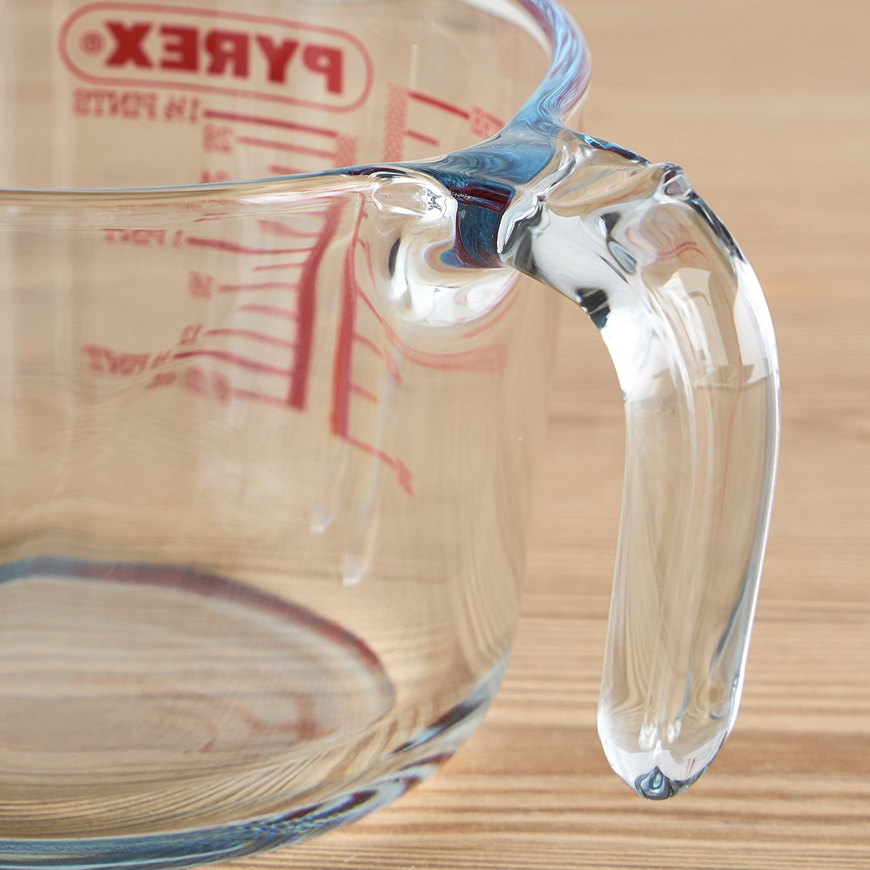 Glass measure outlet jug