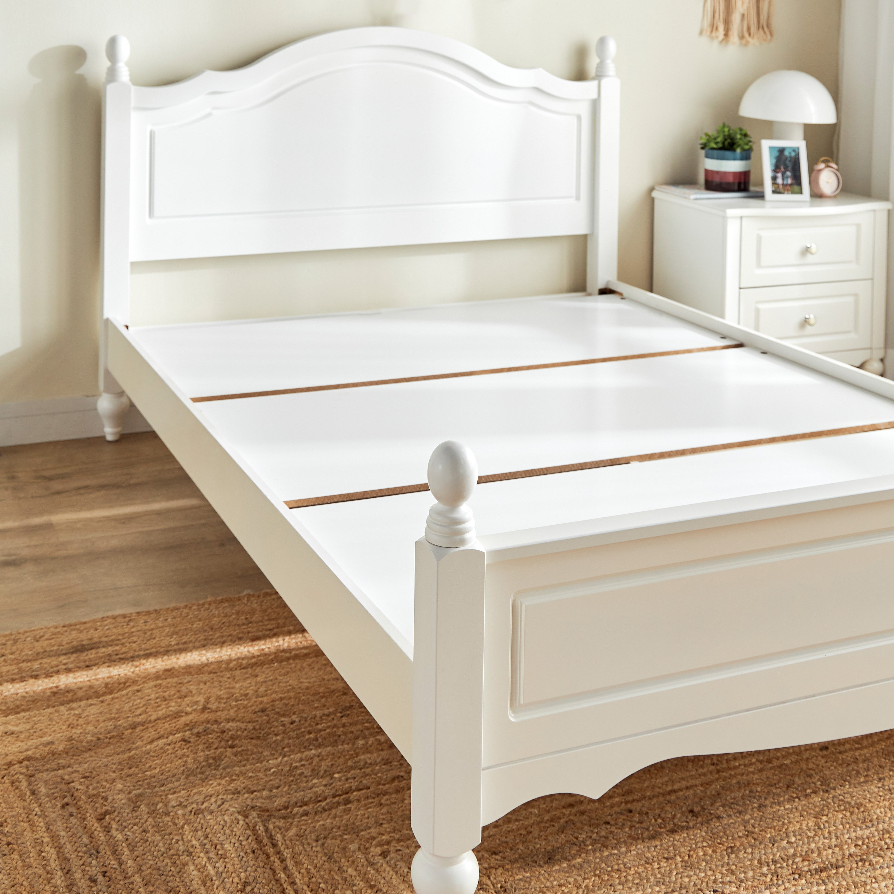 White wooden double bed store with mattress