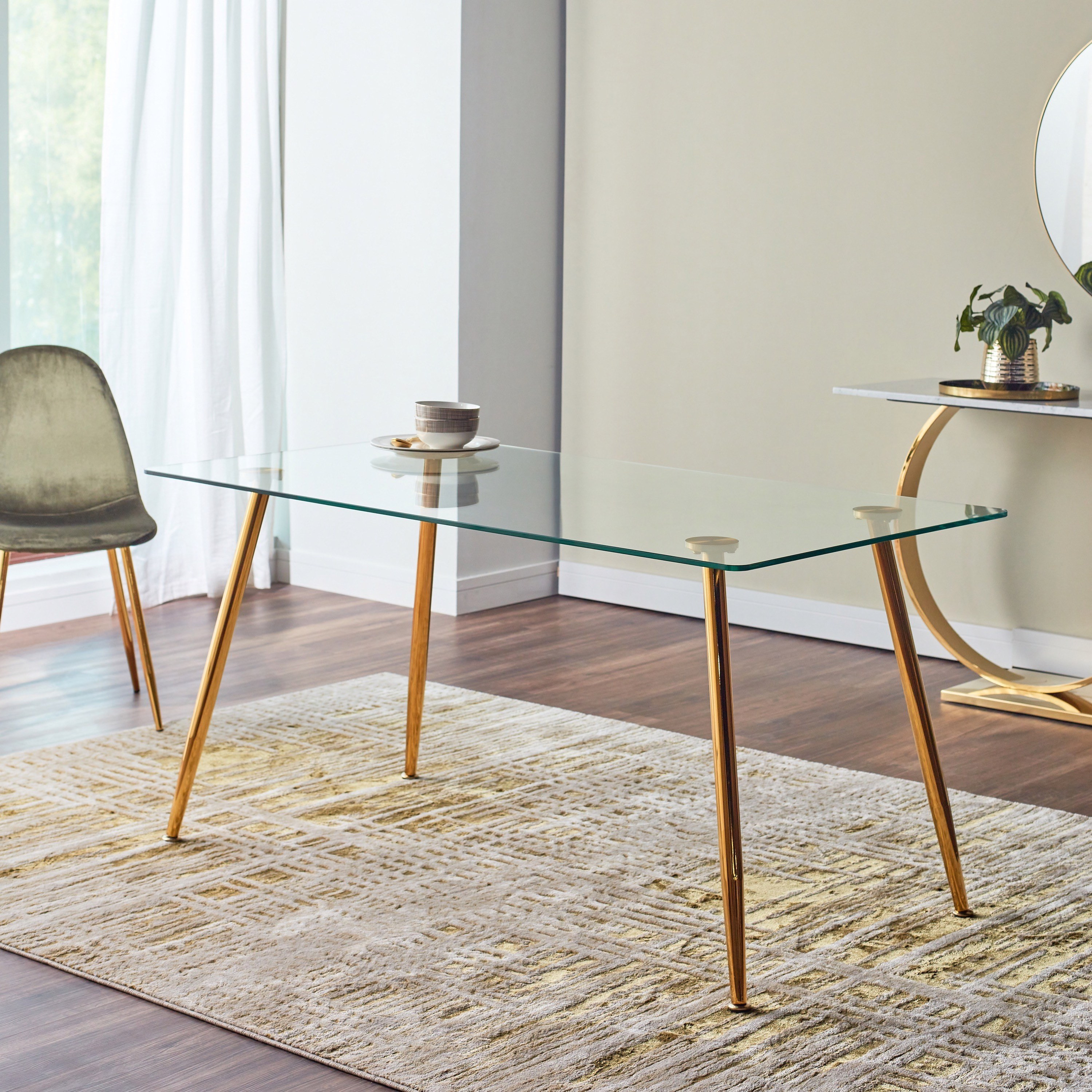 Glass and store brass dining table