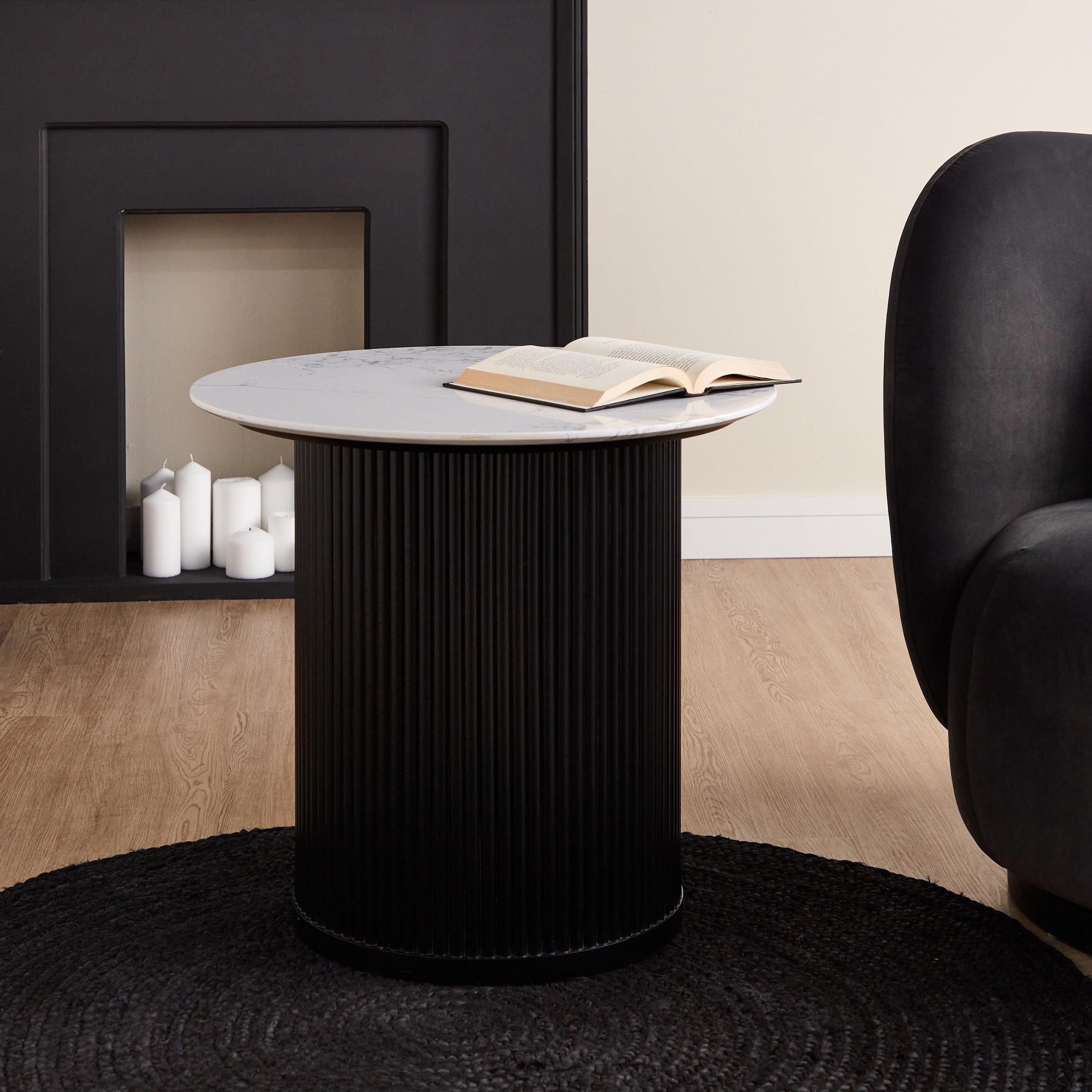 Black round outlet accent table