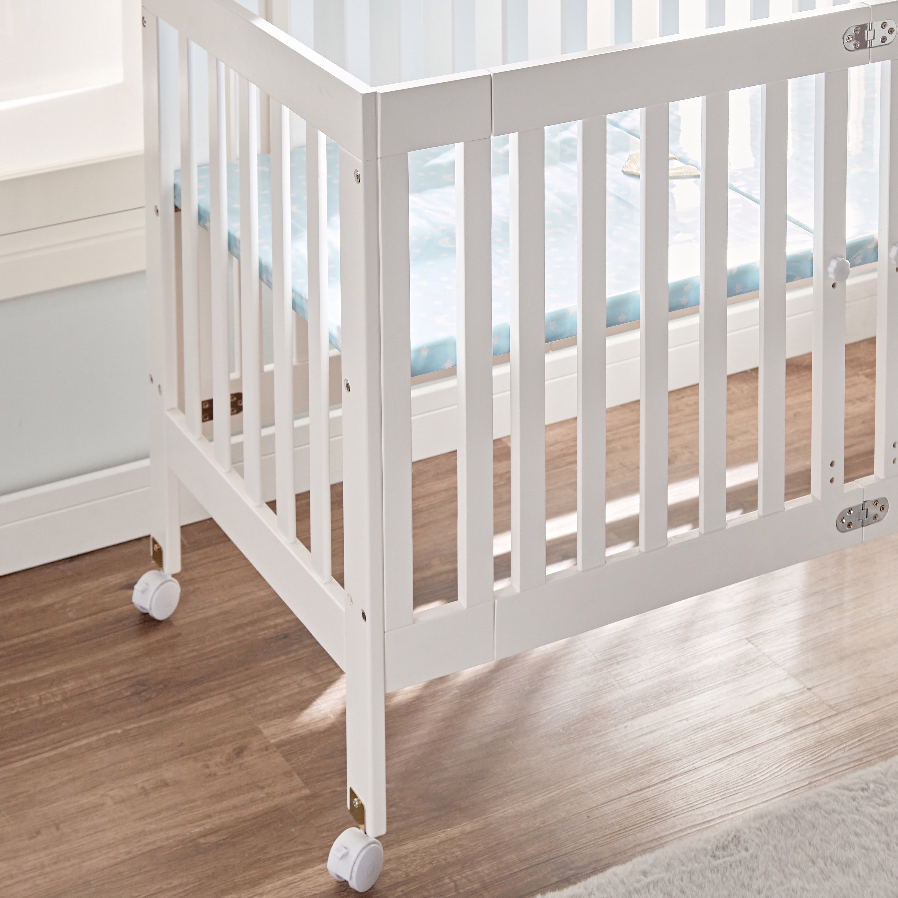 Folding wooden outlet cots for babies