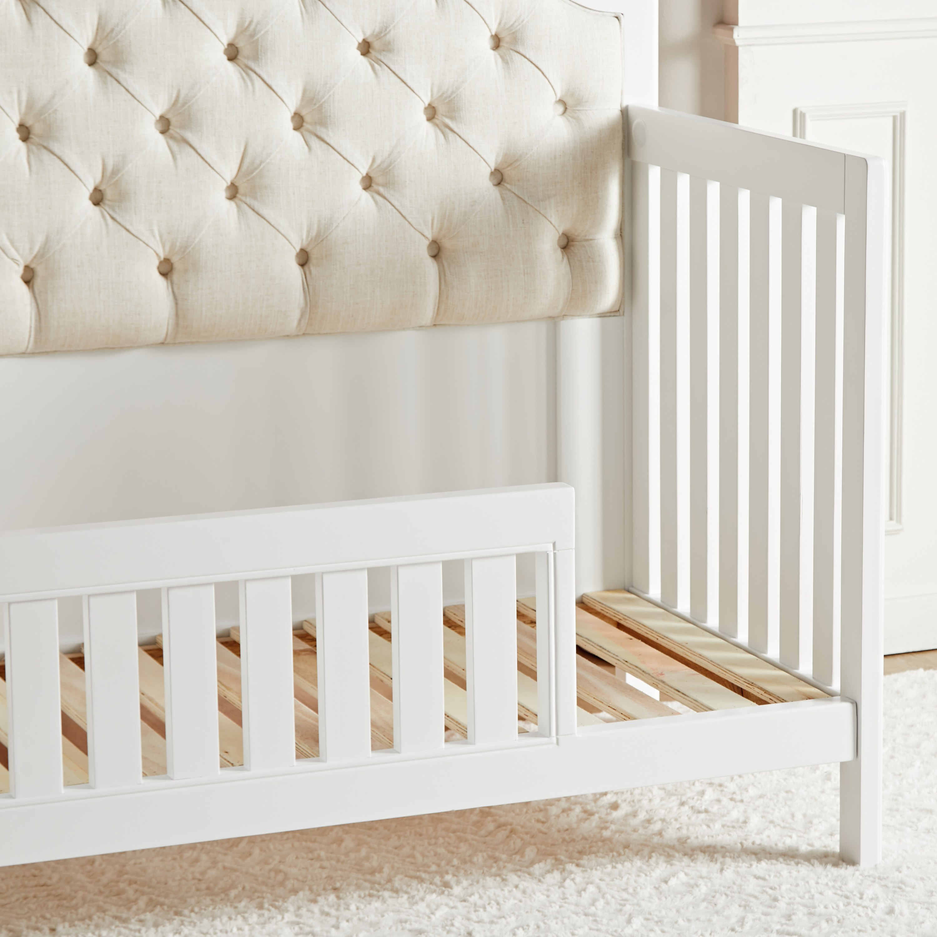 Crib with 2024 cushion headboard