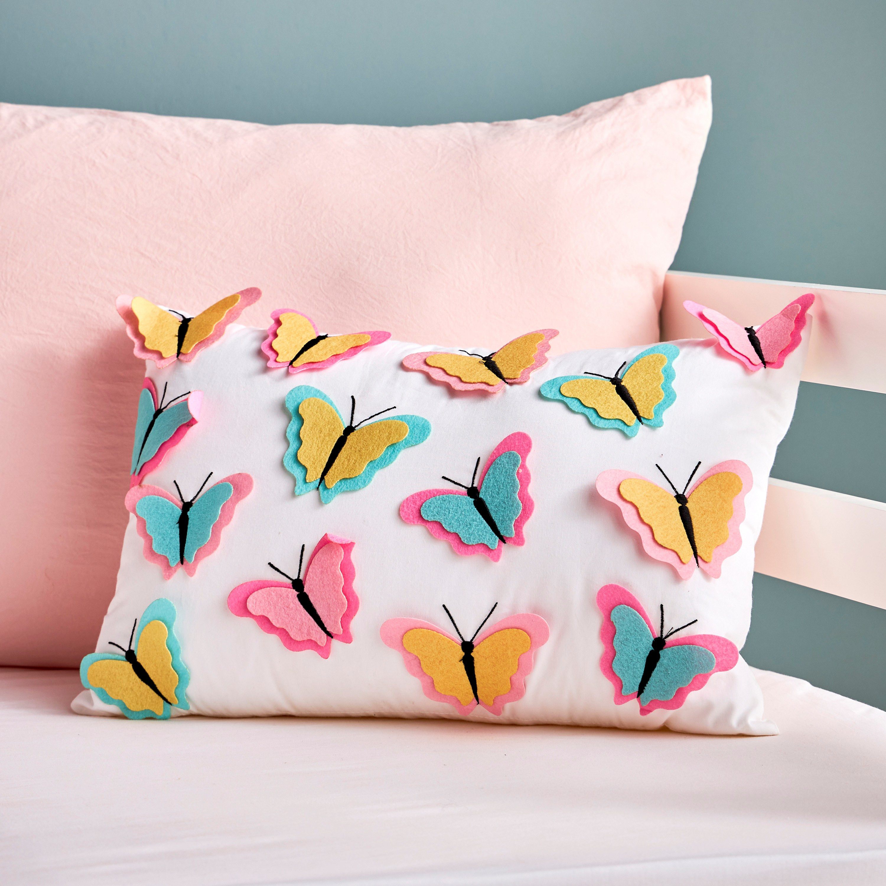 Cushions with cheap butterflies on