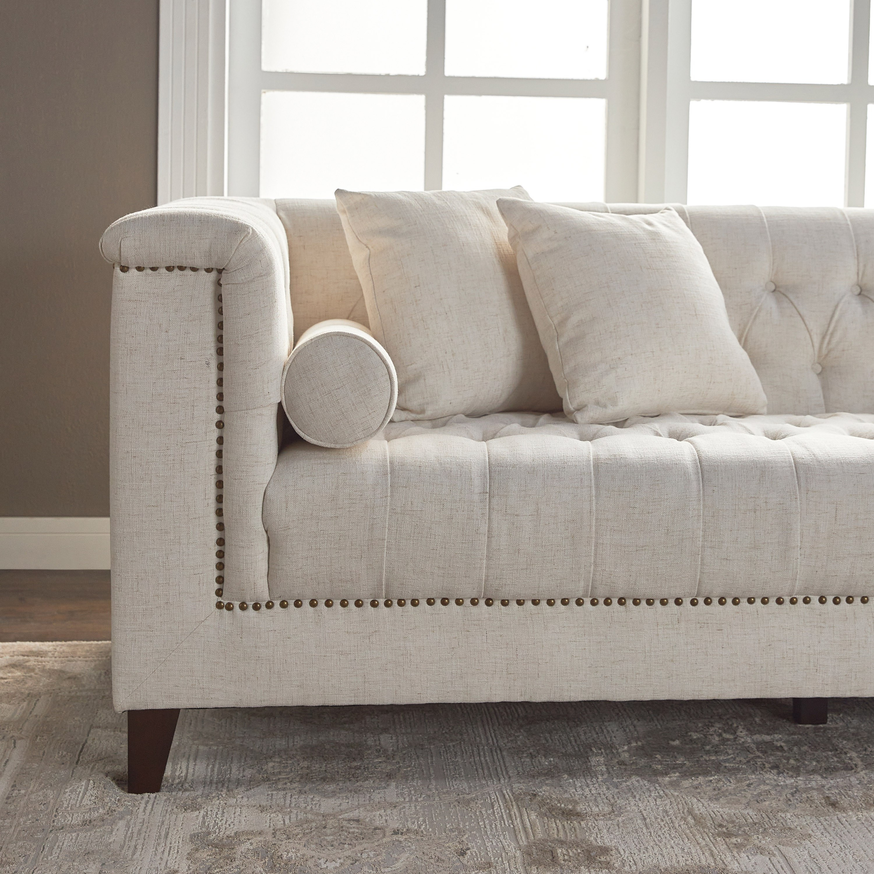 Cream tufted store couch